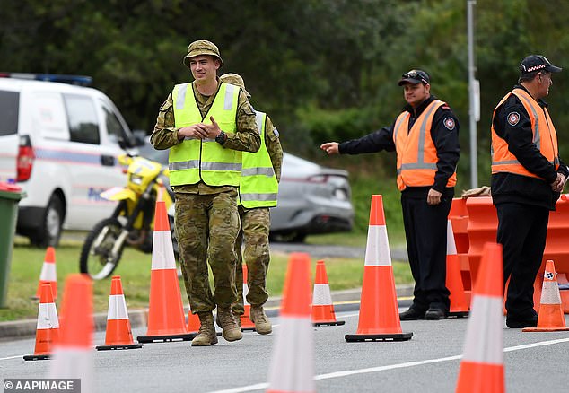 Defence personnel are seen at a checkpoint on the Queensland-New South Wales border in Coolangatta on the Gold Coast on Thursday July 23