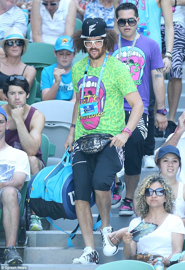 What a gentleman: Upon his arrival, Redfoo was seen dutifully carrying his girlfriend