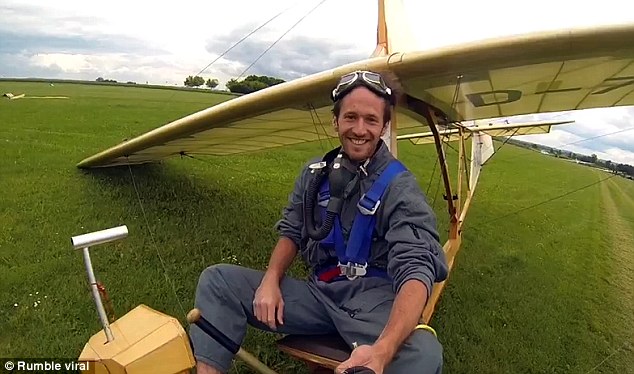 After bringing the fragile, wooden glider down with a textbook landing, the pilot smiles and gives a thumbs up