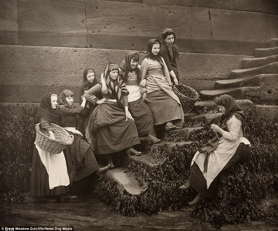 A group of young women who worked in the fishing industry gather in Whitby, Yorkshire, in the 1890s